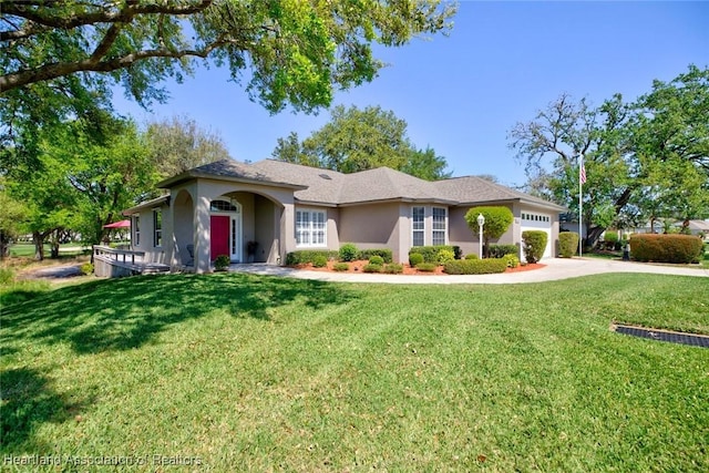 ranch-style house featuring stucco siding, driveway, a front yard, and an attached garage