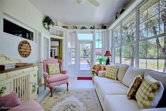 sunroom featuring ceiling fan