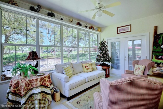 sunroom featuring french doors and ceiling fan