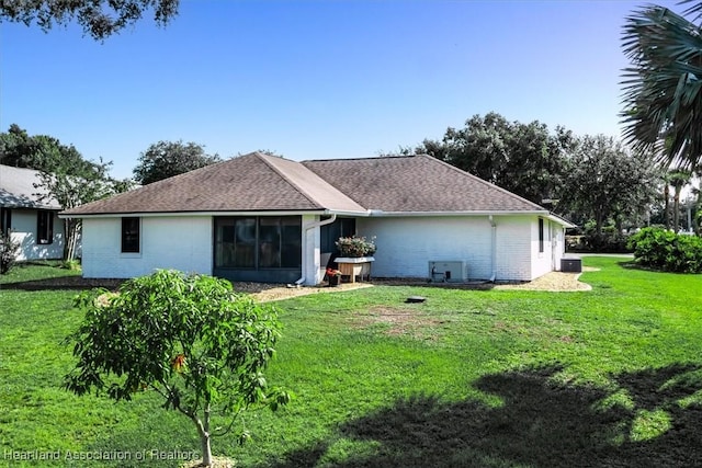 4 Rosewood Dr N, Lake Placid, FL 33852 - back of house featuring brick siding, a lawn, and a shingled roof