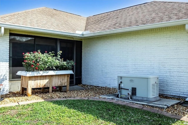 4 Rosewood Dr N, Lake Placid, FL 33852 - entrance to property featuring brick siding and a shingled roof