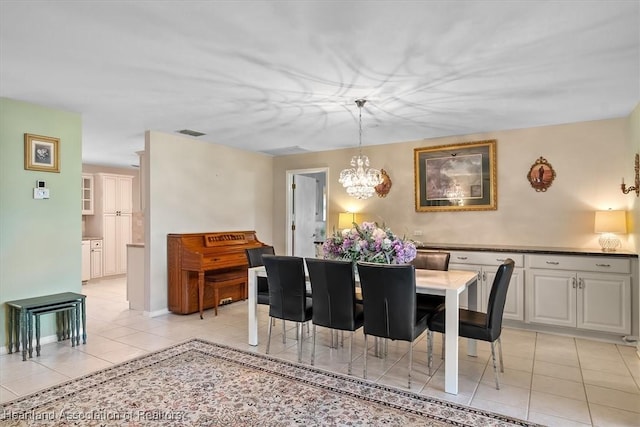 4 Rosewood Dr N, Lake Placid, FL 33852 - dining space featuring a chandelier and light tile patterned floors