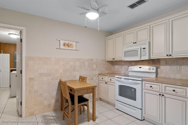 4 Rosewood Dr N, Lake Placid, FL 33852 - kitchen with white appliances, tile walls, light tile patterned floors, ceiling fan, and light countertops