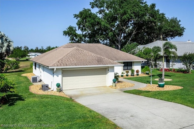 4 Rosewood Dr N, Lake Placid, FL 33852 - view of front facade with a front lawn, concrete driveway, a garage, brick siding, and a shingled roof