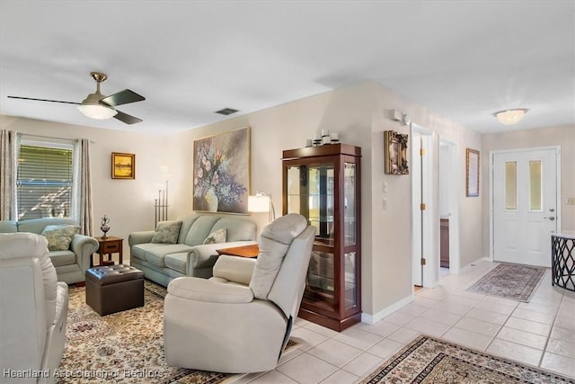 4 Rosewood Dr N, Lake Placid, FL 33852 - living room with light tile patterned floors, a ceiling fan, and baseboards