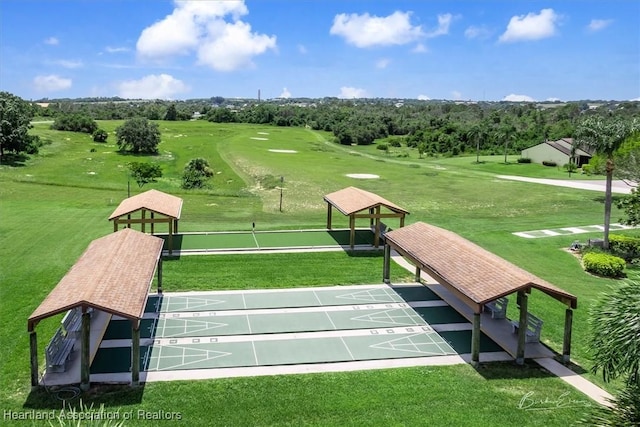 4 Rosewood Dr N, Lake Placid, FL 33852 - surrounding community with shuffleboard, a yard, and golf course view