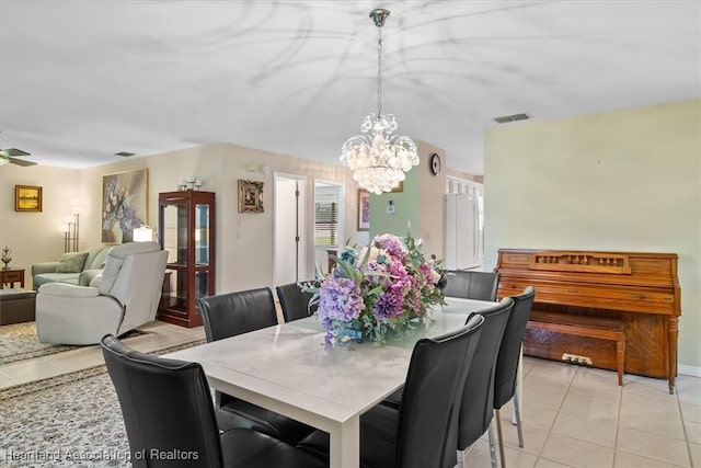 4 Rosewood Dr N, Lake Placid, FL 33852 - dining room featuring light tile patterned flooring and a chandelier