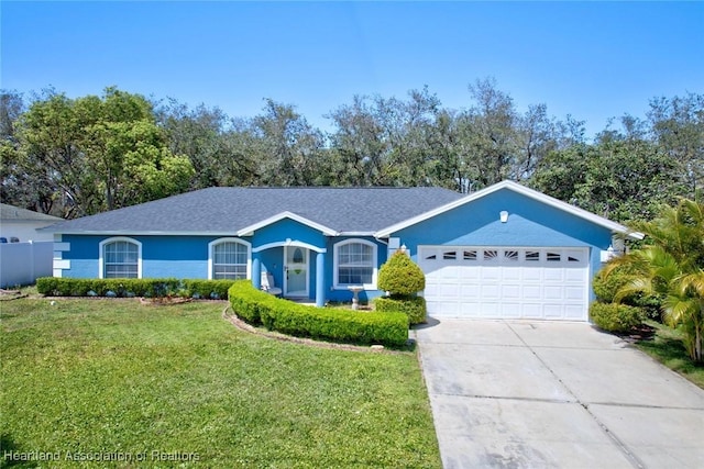 2200 W Geneva Rd, Avon Park, FL 33825 - single story home with a front lawn, driveway, a garage, and stucco siding