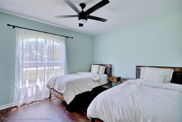 2200 W Geneva Rd, Avon Park, FL 33825 - bedroom featuring wood finished floors, baseboards, and ceiling fan