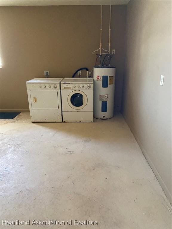 laundry area with water heater and washing machine and dryer