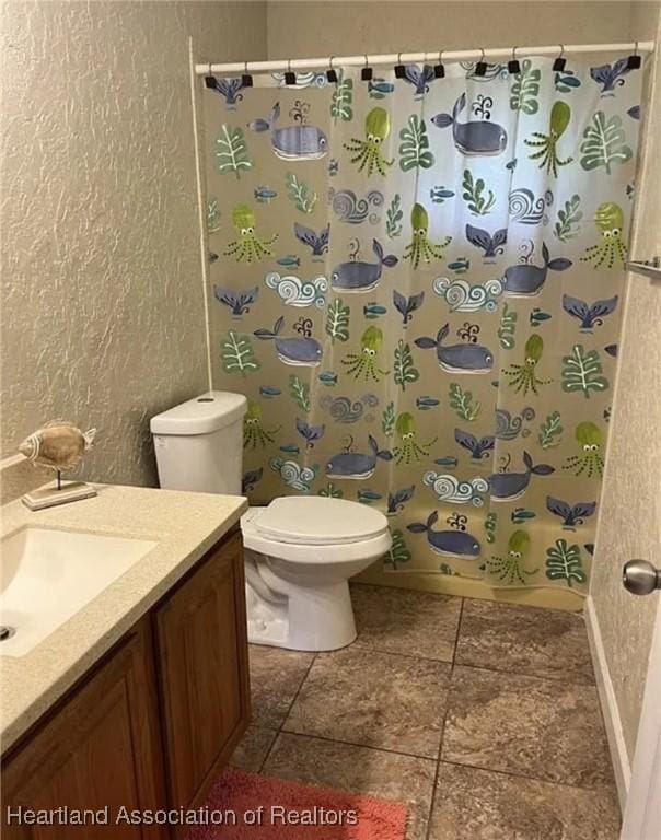 full bathroom featuring vanity, shower / tub combo, and toilet