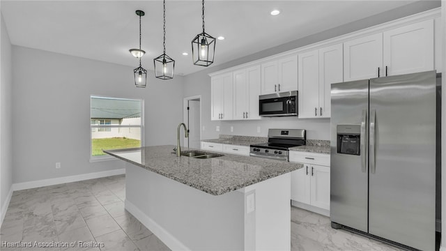 19 N Irvington Rd, Avon Park, FL 33825 - kitchen featuring sink, white cabinets, a center island with sink, and appliances with stainless steel finishes