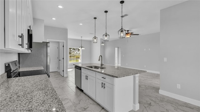 19 N Irvington Rd, Avon Park, FL 33825 - kitchen featuring ceiling fan, sink, white cabinets, range, and an island with sink