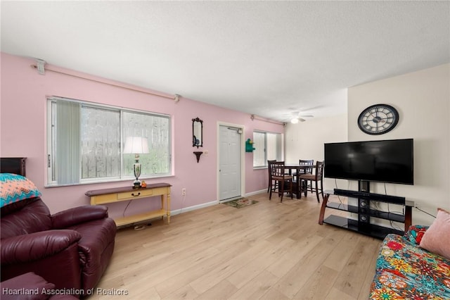 2111 Lakeview Dr Unit 1A, Sebring, FL 33870 - living room featuring light wood-type flooring, baseboards, and ceiling fan