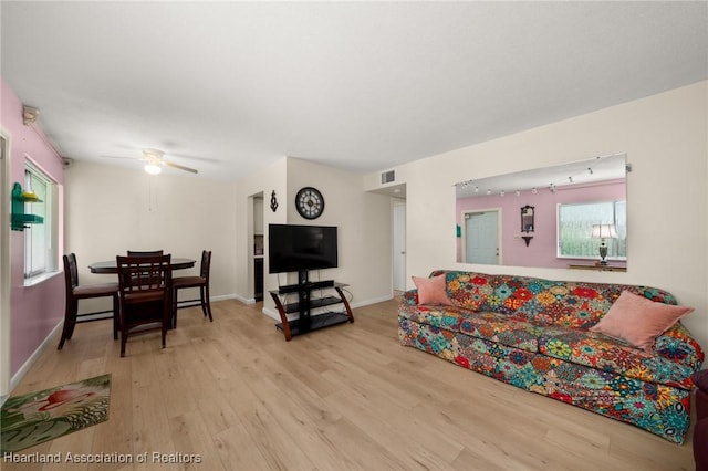 2111 Lakeview Dr Unit 1A, Sebring, FL 33870 - living area featuring wood finished floors, ceiling fan, and baseboards