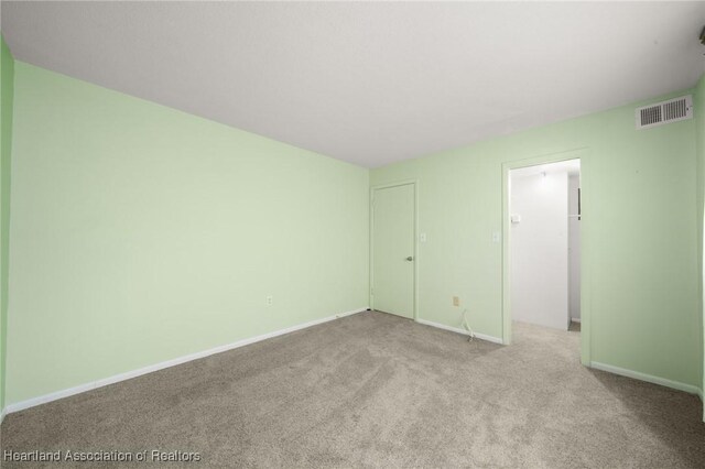 2111 Lakeview Dr Unit 1A, Sebring, FL 33870 - carpeted spare room featuring baseboards