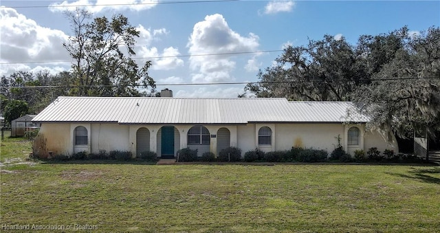 ranch-style house with a front lawn