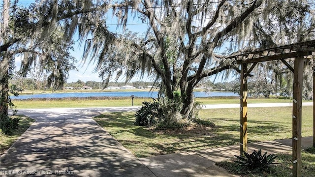 view of home's community with a water view