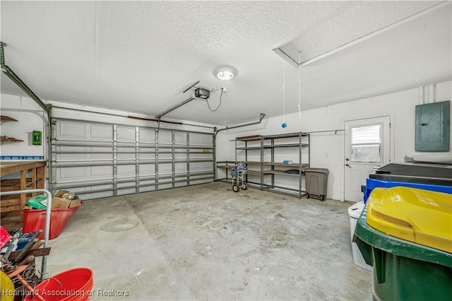 garage featuring a garage door opener and electric panel