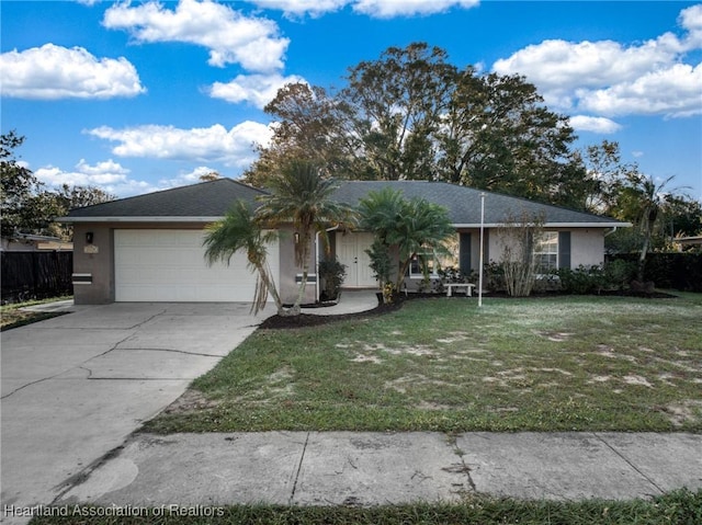 ranch-style home with a garage and a front yard