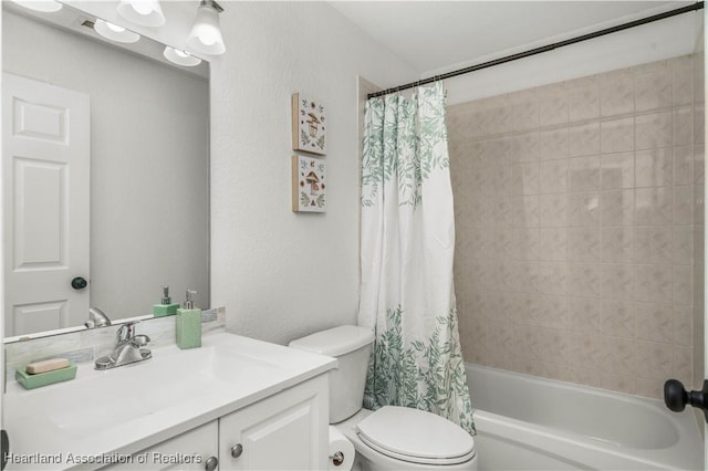 full bathroom with vanity, toilet, and shower / tub combo with curtain