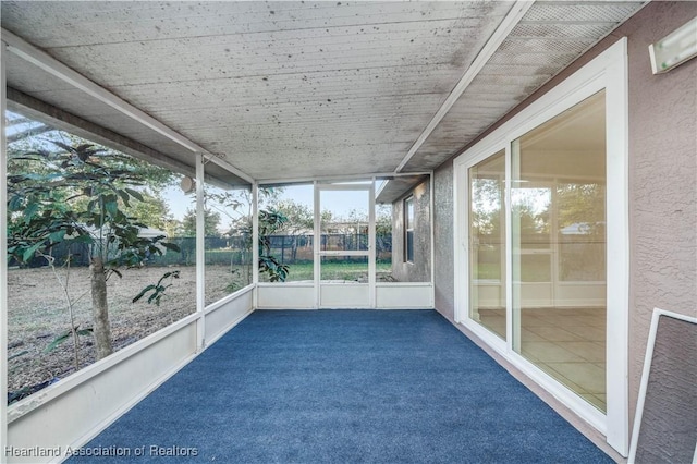 unfurnished sunroom featuring plenty of natural light