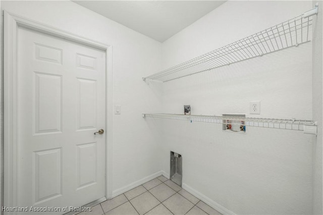 laundry room featuring light tile patterned floors and washer hookup