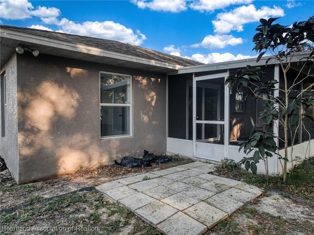 property entrance with a patio area