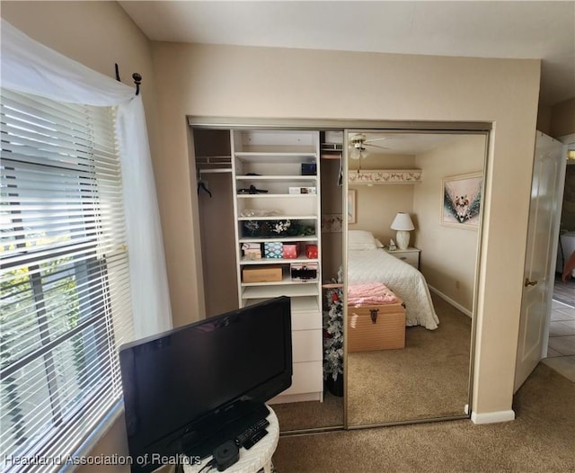 carpeted bedroom featuring a closet