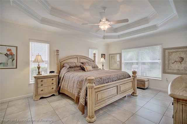 bedroom featuring light tile patterned floors, a tray ceiling, ceiling fan, and crown molding