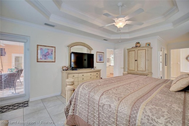 bedroom featuring a tray ceiling, ceiling fan, light tile patterned floors, and ornamental molding