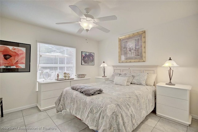 tiled bedroom with ceiling fan