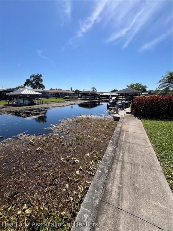 water view featuring a gazebo and a dock