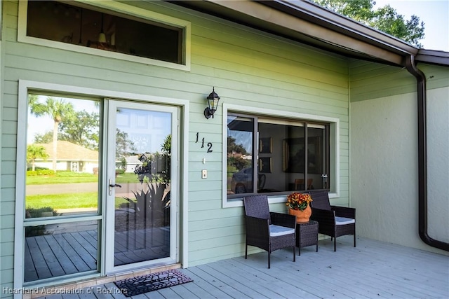 entrance to property with a wooden deck