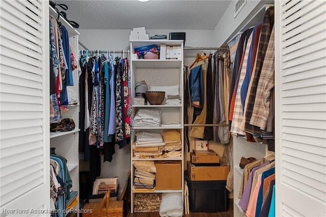 spacious closet featuring visible vents