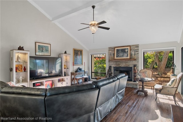living room featuring vaulted ceiling with beams, dark wood-style flooring, ceiling fan, and a stone fireplace