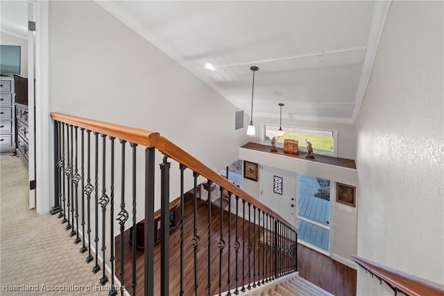 staircase featuring visible vents, baseboards, and crown molding