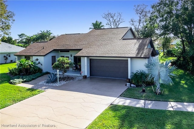 ranch-style home featuring concrete driveway, stucco siding, an attached garage, and a front yard