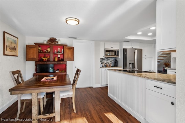 dining area featuring recessed lighting, baseboards, dark wood finished floors, and visible vents