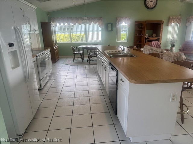 kitchen featuring range with electric cooktop, dishwasher, lofted ceiling, white fridge with ice dispenser, and a sink