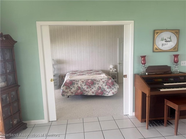 tiled bedroom with carpet flooring