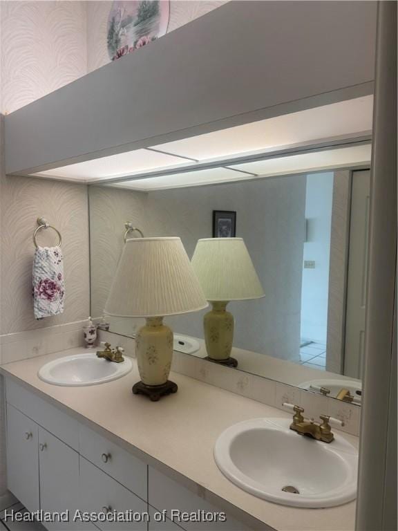 bathroom featuring double vanity and a sink