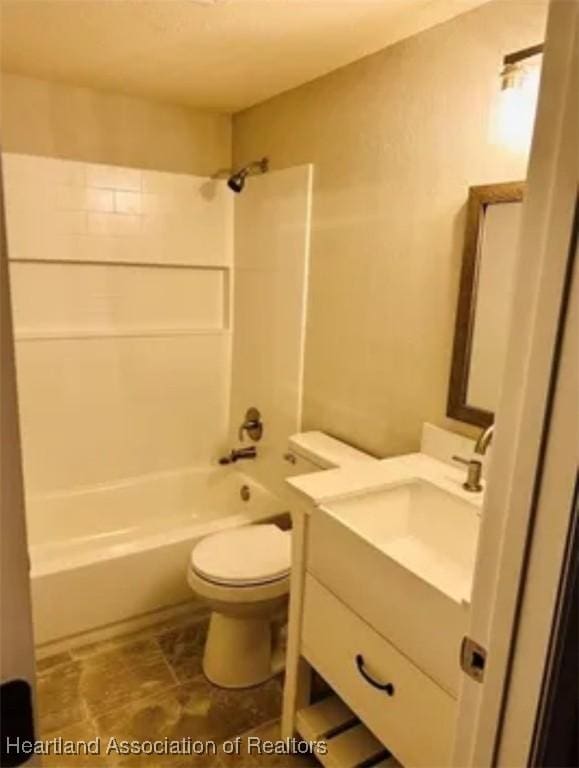 full bathroom with toilet, vanity, and tub / shower combination