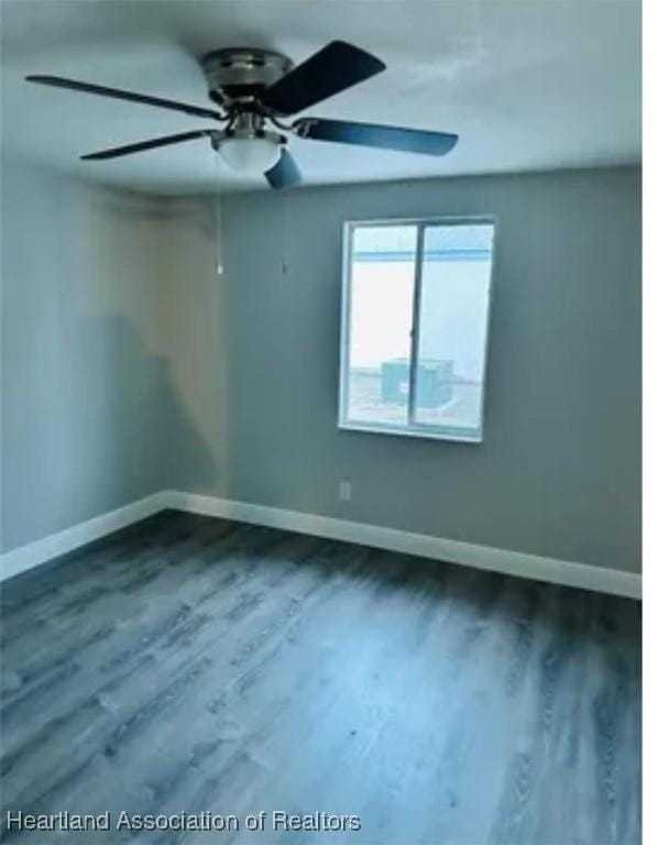 empty room with hardwood / wood-style floors