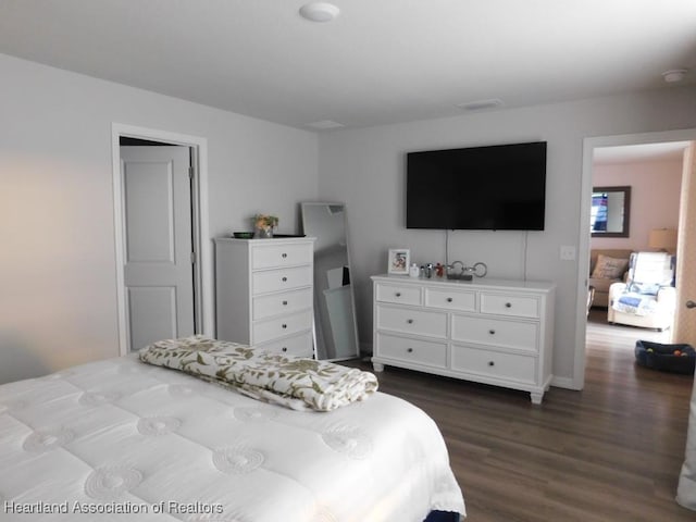 bedroom featuring dark hardwood / wood-style floors