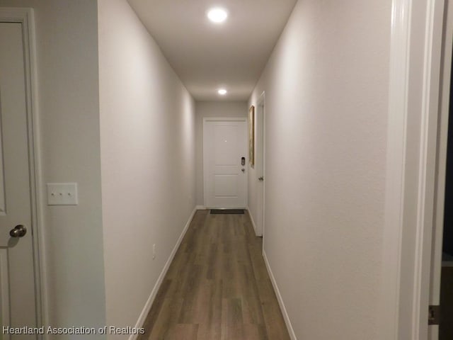 corridor featuring wood-type flooring