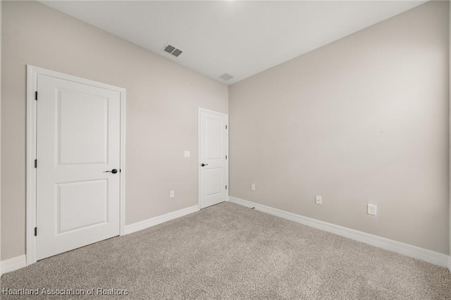 4924 San Lorenzo Dr, Sebring, FL 33872 - unfurnished bedroom featuring visible vents, baseboards, and carpet floors