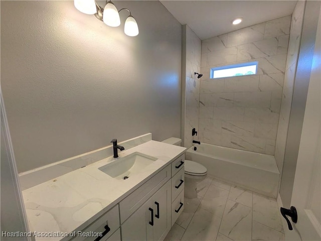 full bathroom with vanity, toilet, and tiled shower / bath combo