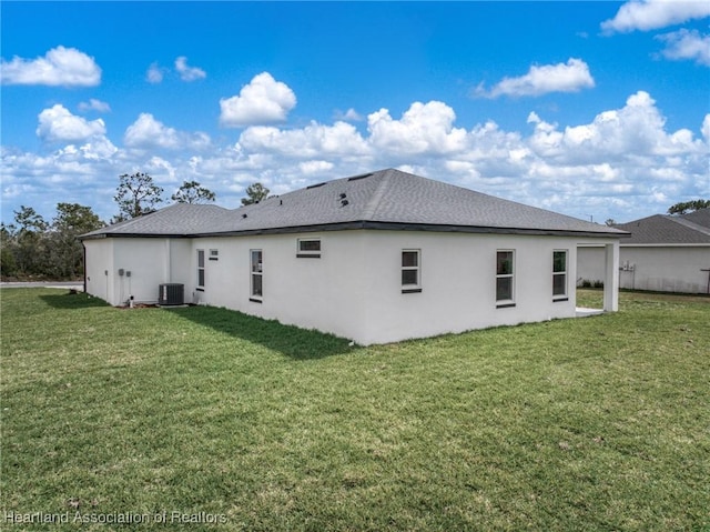 4924 San Lorenzo Dr, Sebring, FL 33872 - back of property with a yard, stucco siding, and central AC