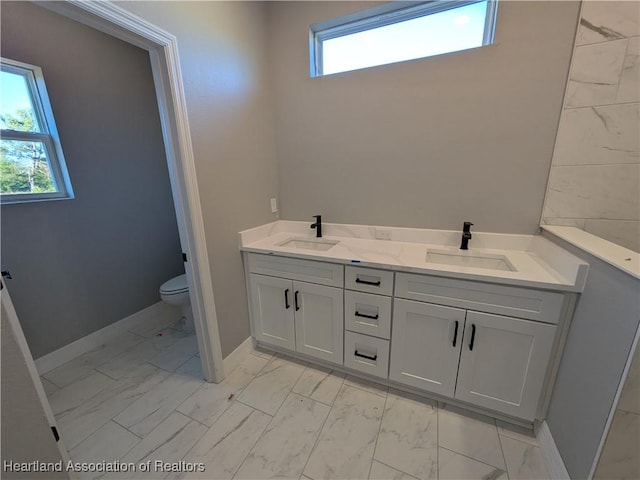 bathroom featuring vanity and toilet